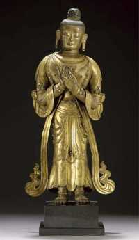 16th/17th Century A large Tibetan gilt copper model of Maitreya